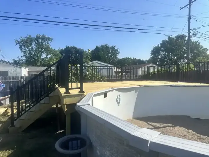 Finished residential deck with stairs and yard