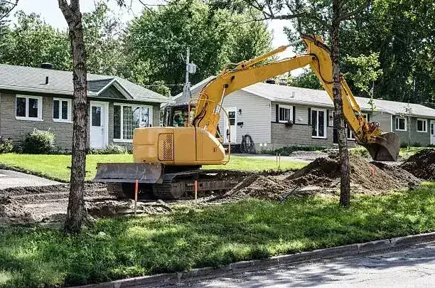 Excavator working on a residential property